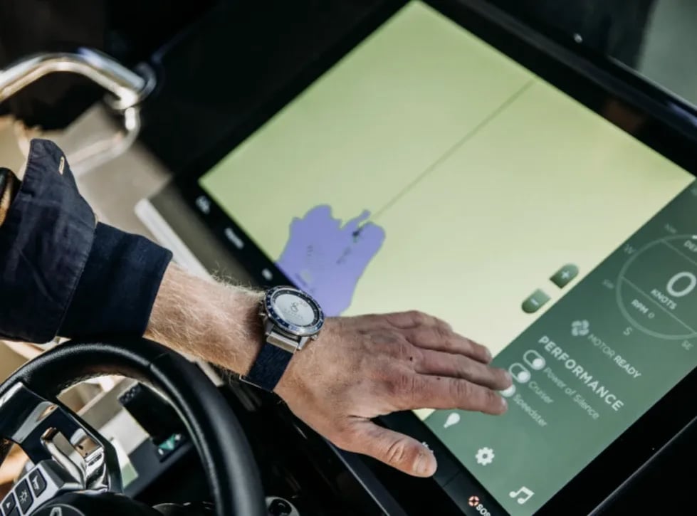 Driver using the touchscreen control system aboard the X Shore Eelex 8000