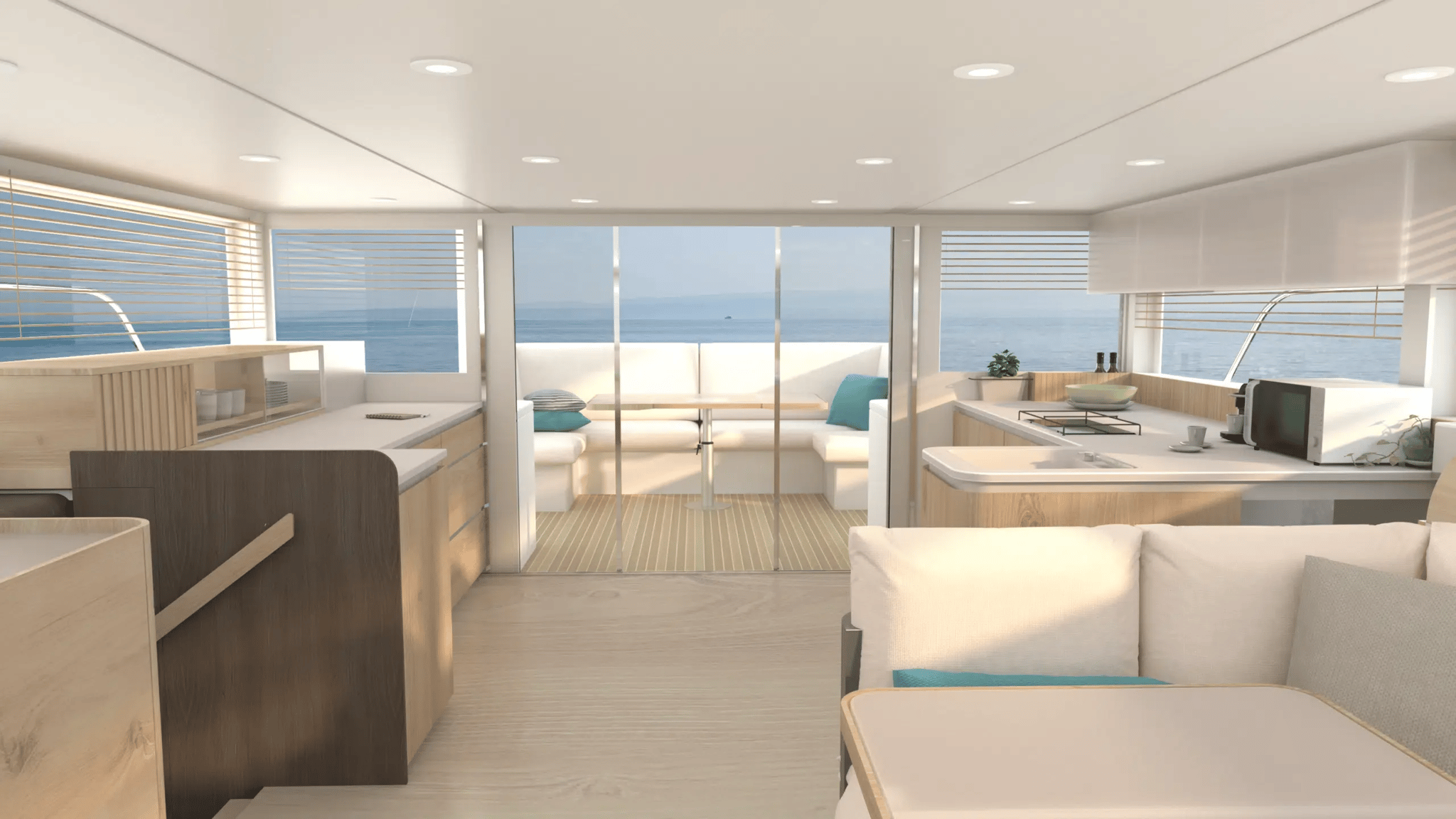 A white boat with a blue couch and a blue pillow.