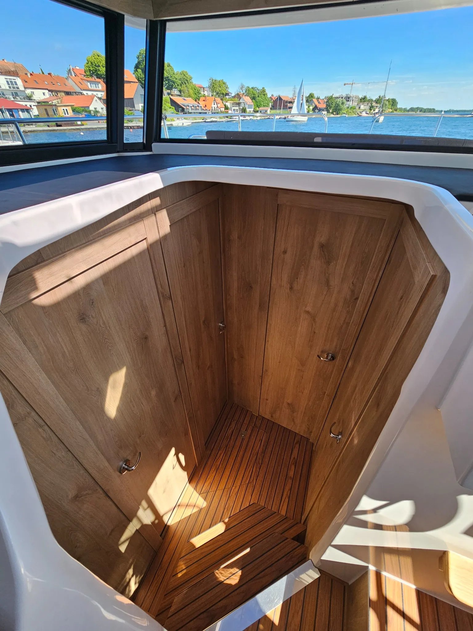 Companionway and steps leading from the main deck to the cabins of the Lamdo eLY30+.