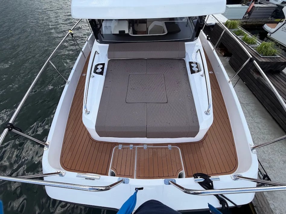 Elevated view of the Lamdo eLY30+ foredeck with its large sunpad and walkaround deck.