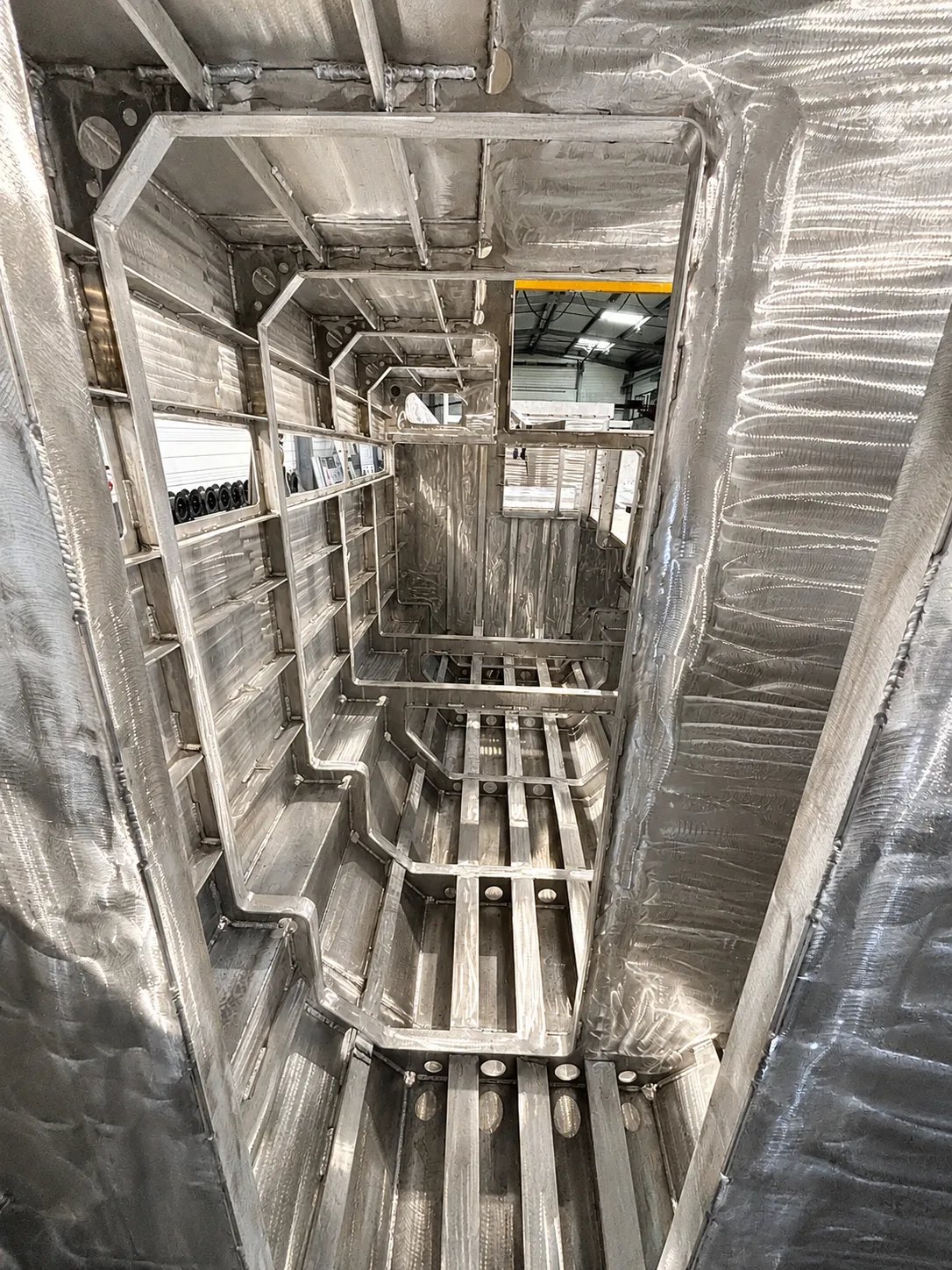 nternal aluminium frame structure of the Solann, showing welded bulkheads, stringers and insulated side panels.