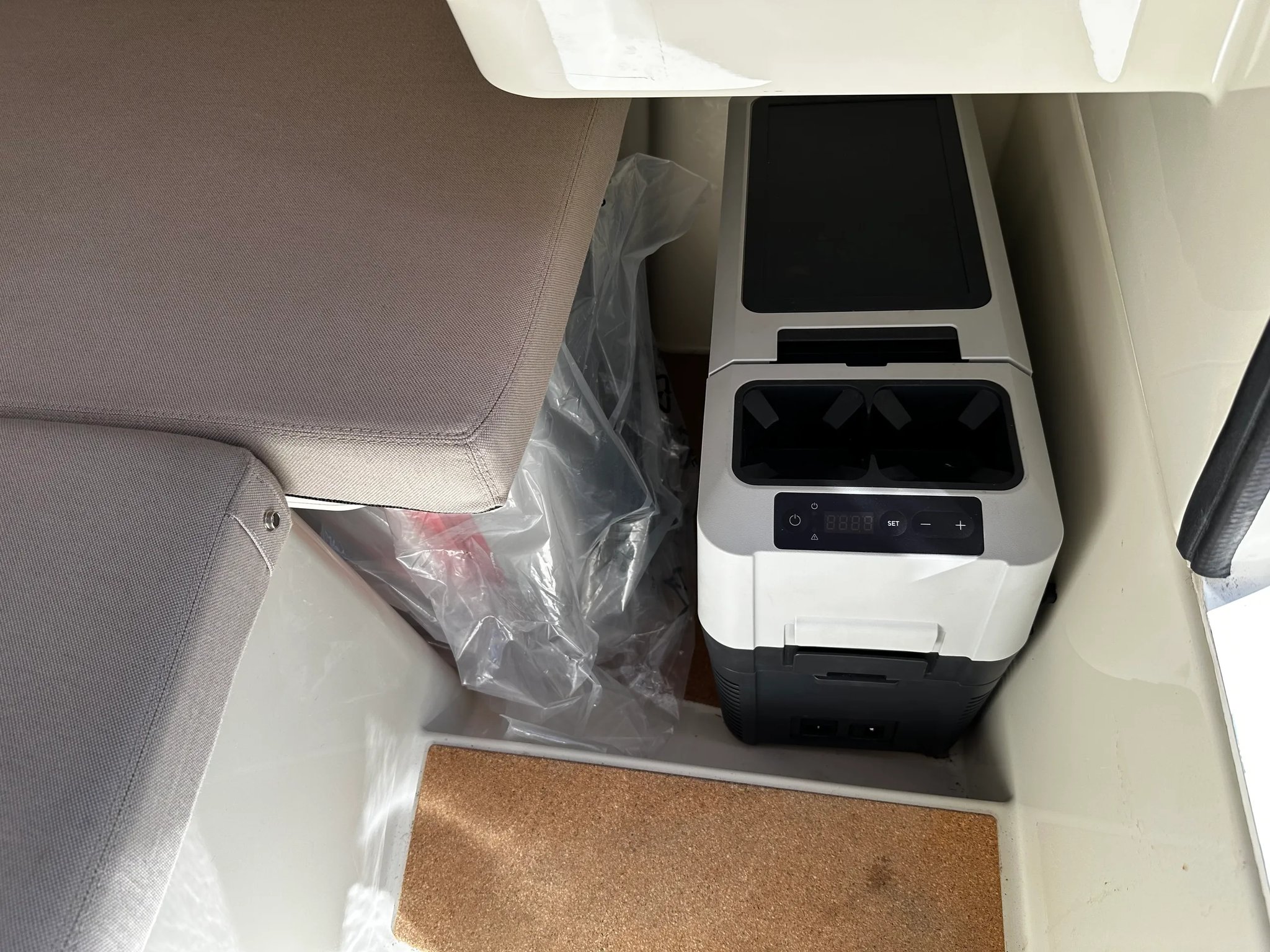 X Shore 1 Open Performance interior with Dometic refrigerator and storage space