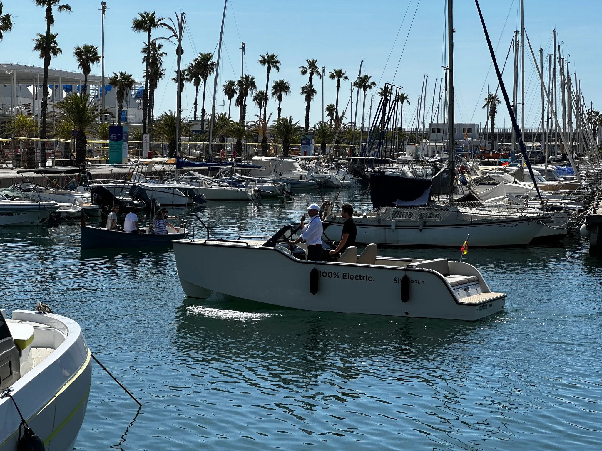 X Shore 1 Open Performance electric boat underway inside a marina