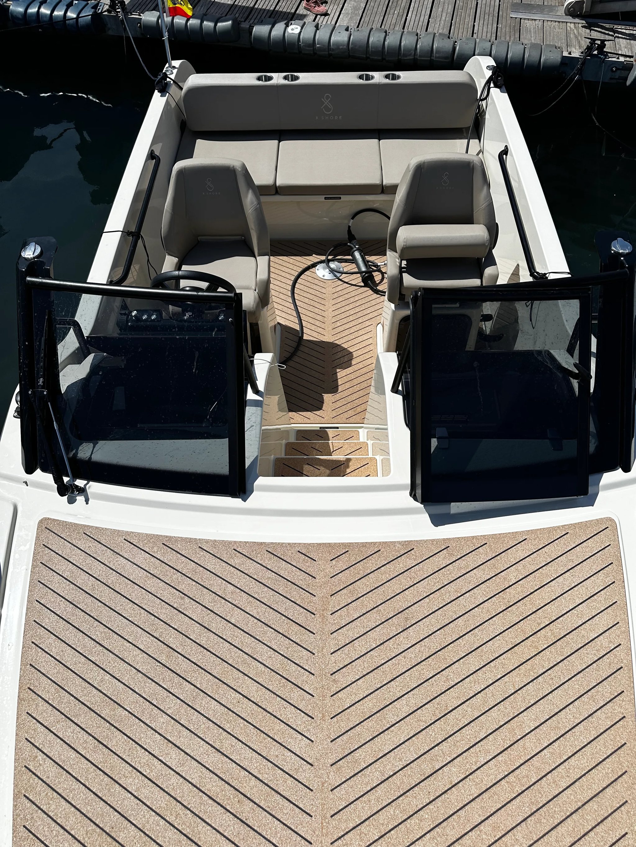 X Shore 1 Open Performance open cockpit with cork deck and forward windscreens