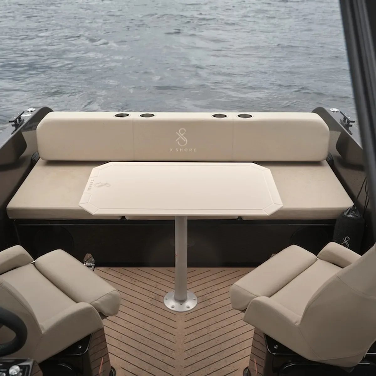 Aft cockpit dining area with adjustable seating aboard the X Shore 1