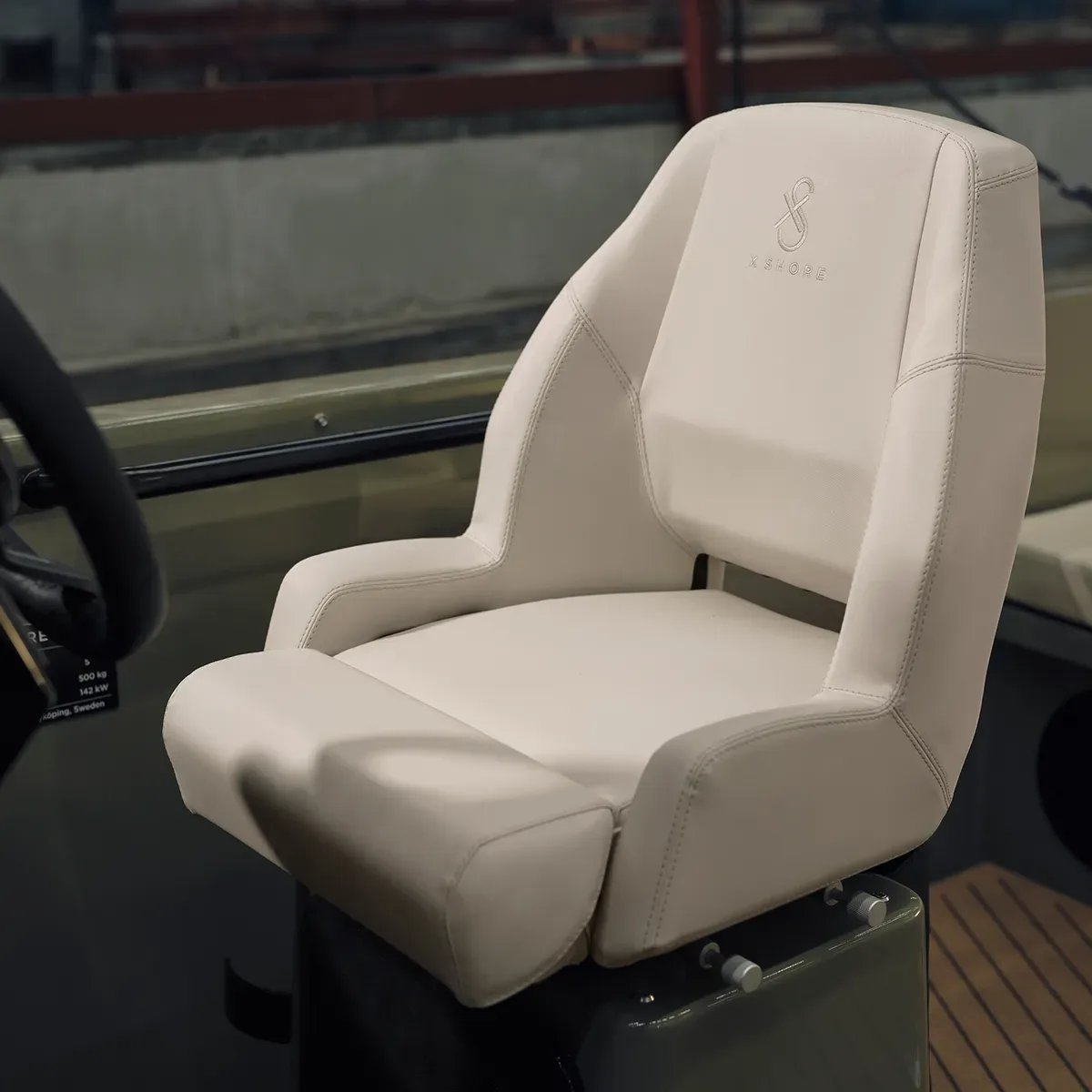 Adjustable helm seat aboard the X Shore 1 electric boat