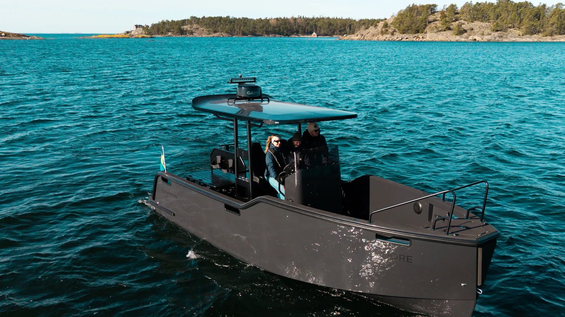 X Shore PRO T-top electric workboat viewed from the front while underway