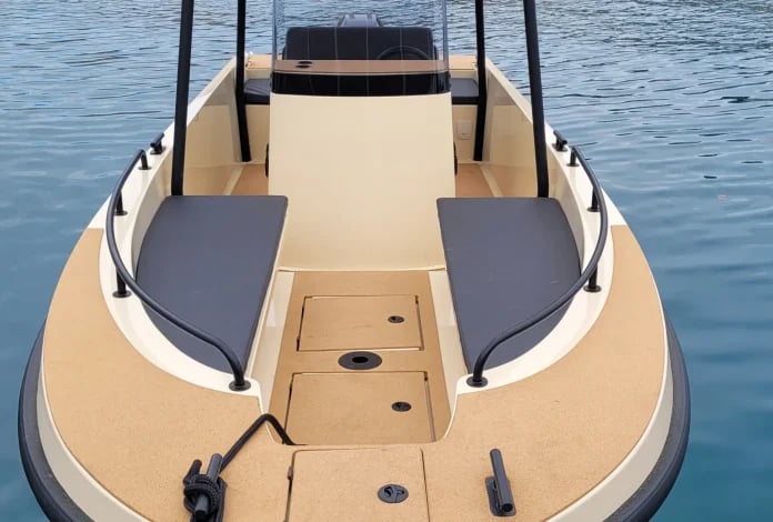 A boat with a black seat in the front.