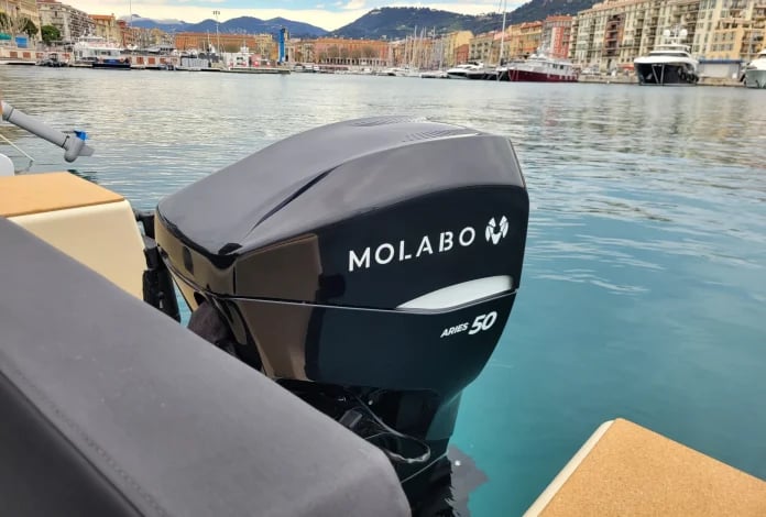 A black boat with the word Molabo on it.