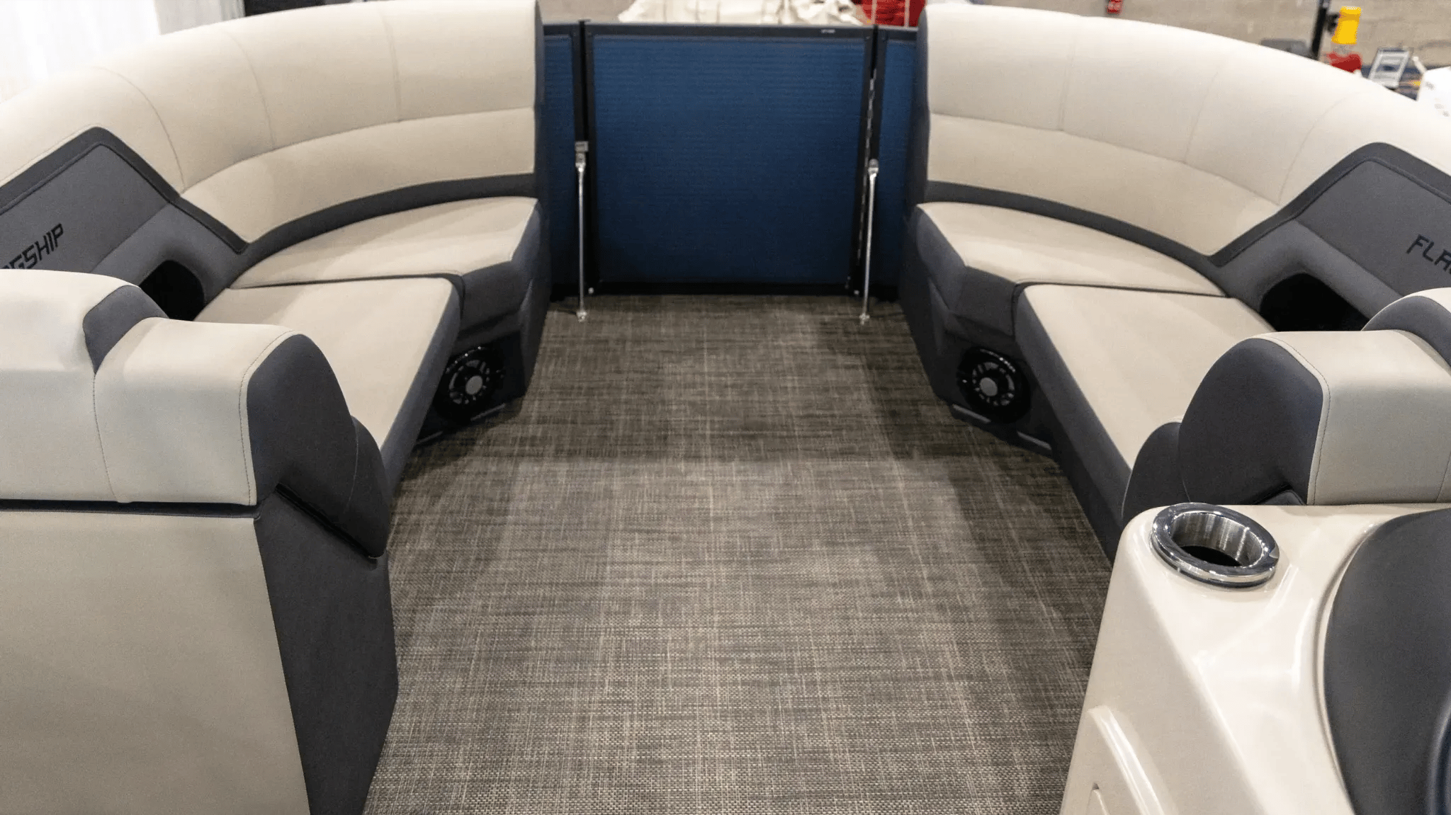A boat with a blue and black seat.