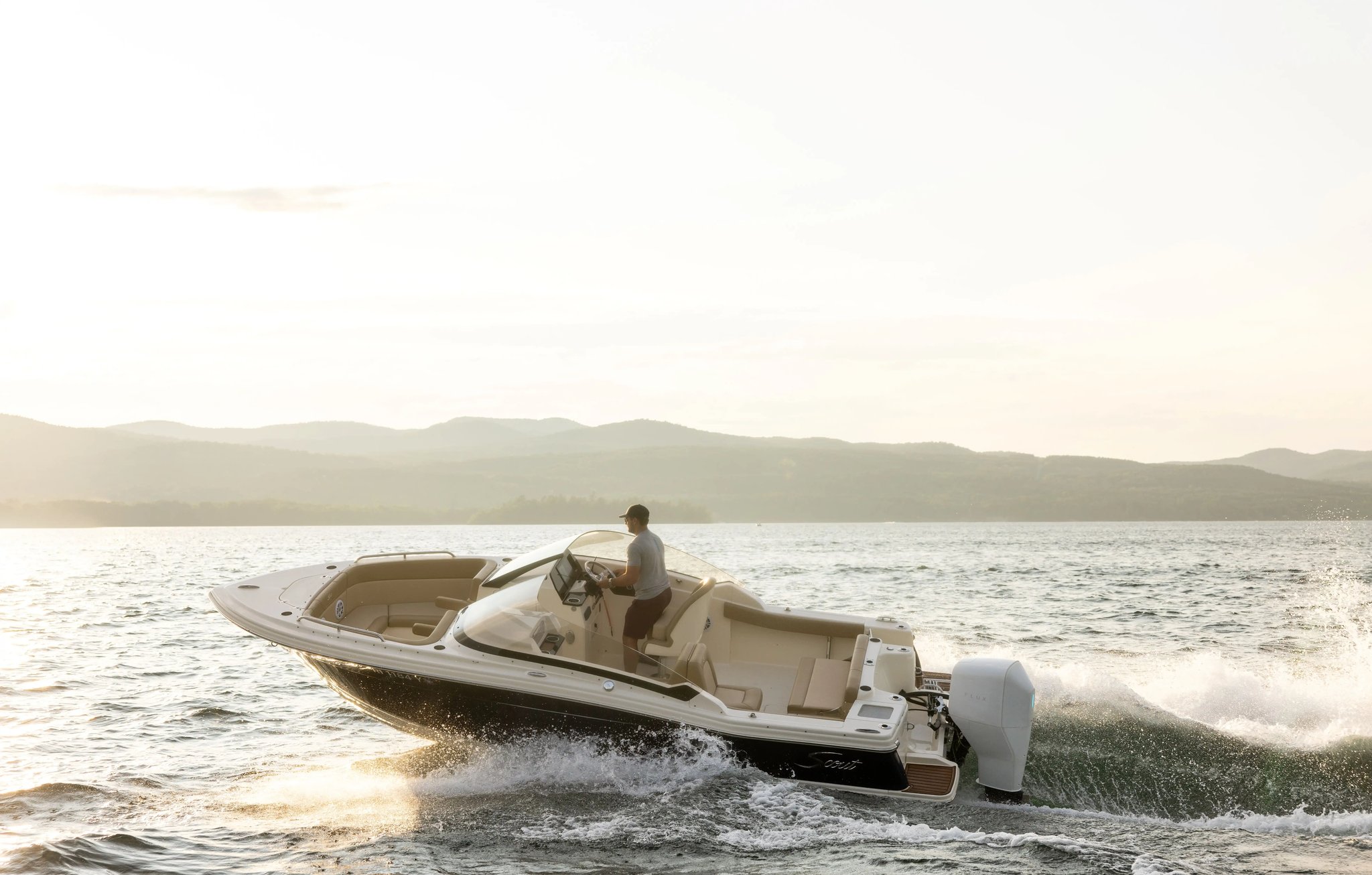 A man is on a boat in the water.