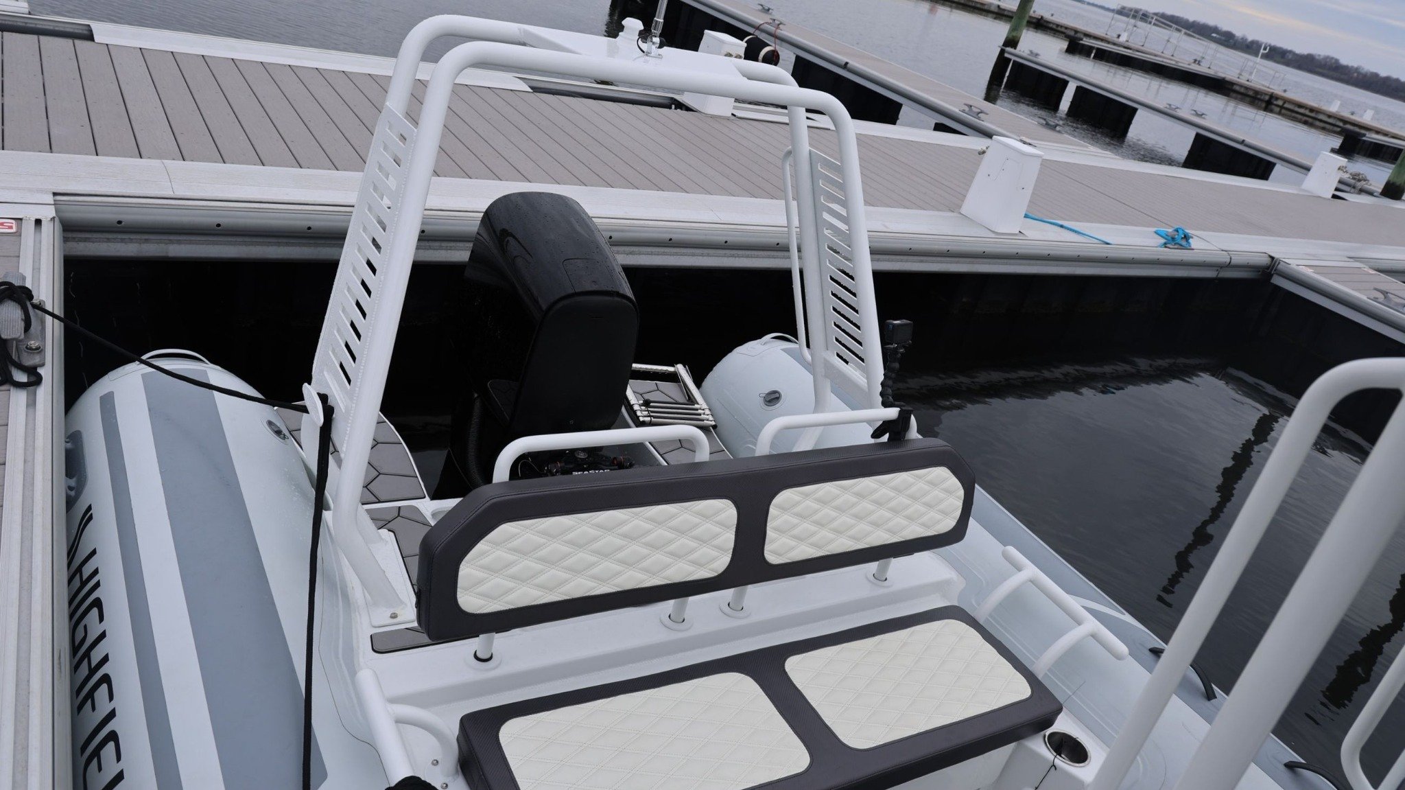 A white boat with a black seat.