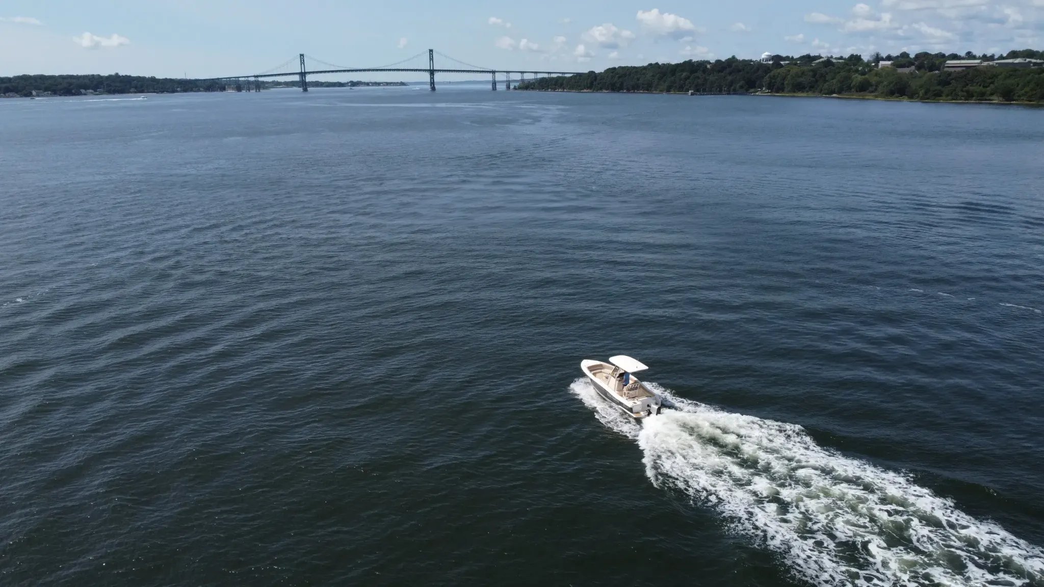 A white boat on the water.
